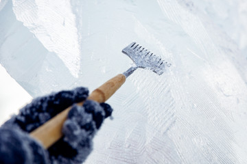Ice sculpture carving man use chisel cut frozen winter