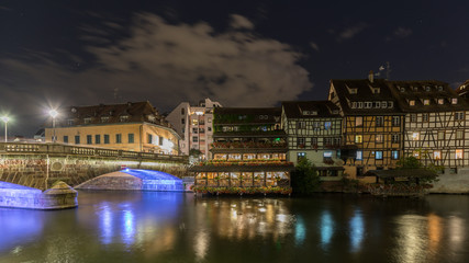 Fototapeta na wymiar The water Reflection at night in the little France in Strasbourg in France