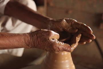 Potter man, clay molding, shaping clay molding potter, potter hand clay mold