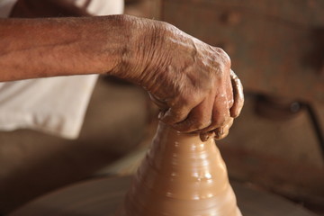 Potter man, clay molding, shaping clay molding potter, potter hand clay mold