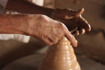 Potter man, clay molding, shaping clay molding potter, potter hand clay mold
