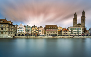 Fototapeta na wymiar Limmat River at Sunset in Zürich, Switzerland. Panoramic long exposure of the view of historic Zurich city center and river Limmat , Switzerland Europe