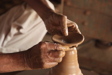 Potter man, clay molding, shaping clay molding potter, potter hand clay mold