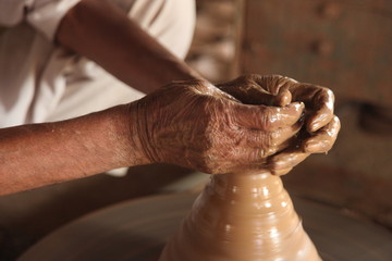 Potter man, clay molding, shaping clay molding potter, potter hand clay mold