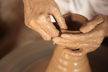 Potter man, clay molding, shaping clay molding potter, potter hand clay mold