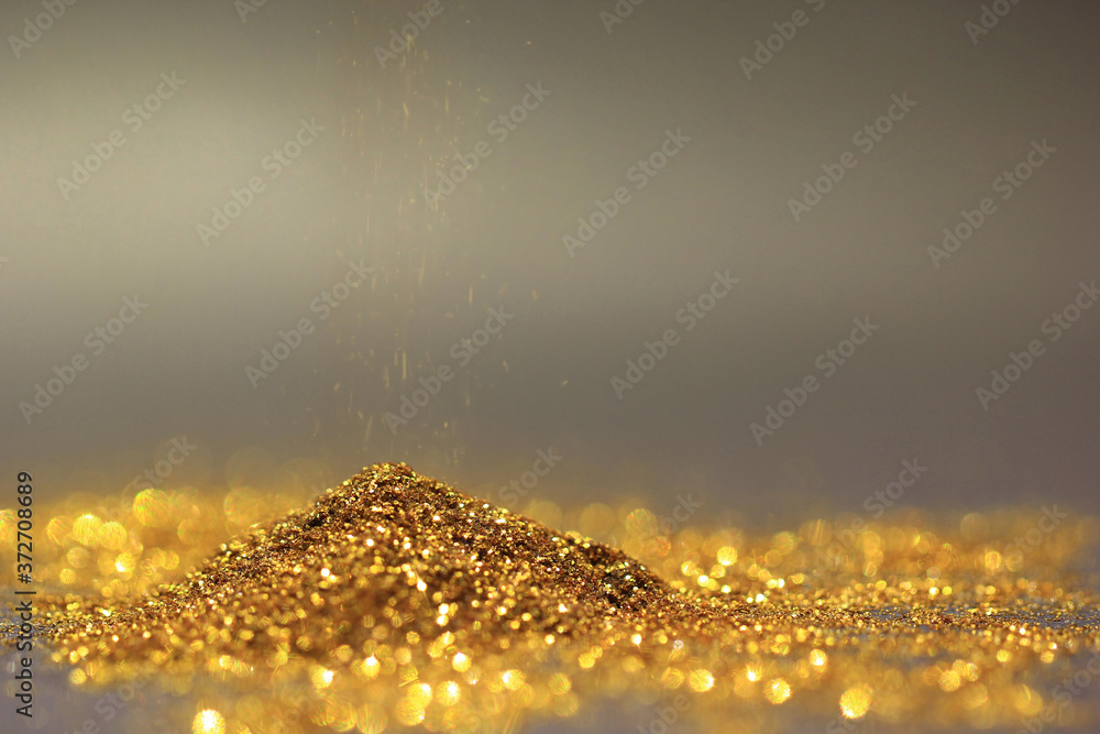 Wall mural sprinkle gold dust and glitter lights on dark background