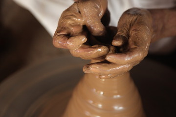 Potter man, clay molding, shaping clay molding potter, potter hand clay mold