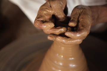 Potter man, clay molding, shaping clay molding potter, potter hand clay mold