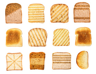 Set with toasted slices of wheat bread on white background, top view