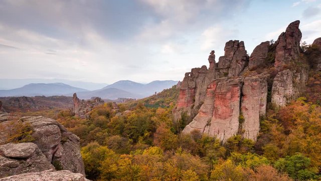 Time lapse with moving clouds at autumn picturesque rock formation,  Belogradchik rocks, Bulgaria