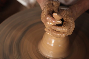 hands of a potter at work