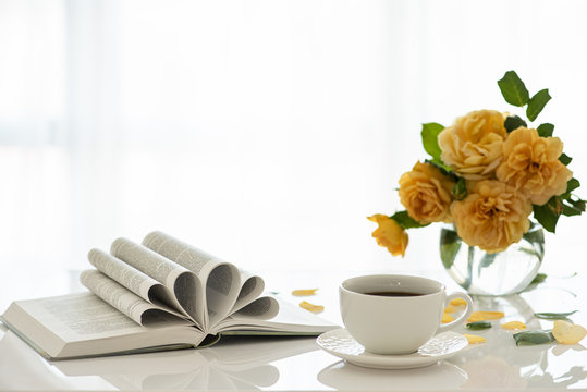 A cup of coffee. Good morning. Tea time with a book