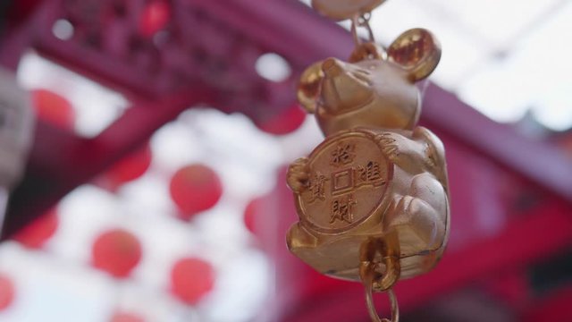 The mobile of the rat year. The Chinese symbol of lucky life or the feng shui symbol in the Chinese shrine or Chinese temple. The meaning of the words are the rich or good luck in money and happiness.