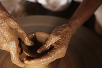 Potter man, clay molding, shaping clay molding potter, potter hand clay mold