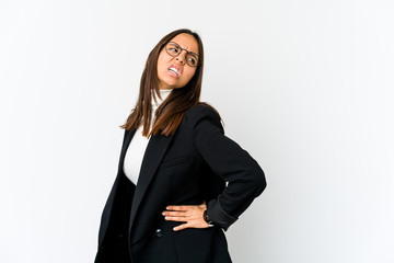 Young mixed race business woman isolated on white background suffering a back pain.