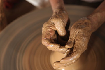 Potter man, clay molding, shaping clay molding potter, potter hand clay mold
