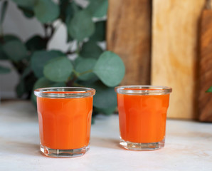 Fresh carrot in glass glasses. The concept of healthy nutrition.