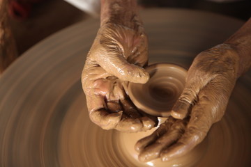 Potter man, clay molding, shaping clay molding potter, potter hand clay mold