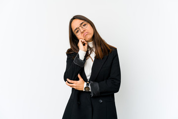 Young mixed race business woman isolated on white background who feels sad and pensive, looking at copy space.