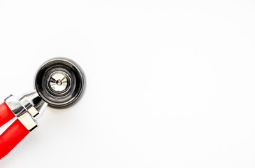 Close up view of red stethoscope isolated on white background. Medicine and health concept. Cardiology