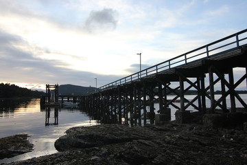 The Mayne Island government dock overlooking Active Pass at low tide in British Columbia Canada.