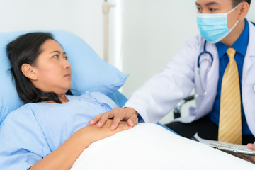 Close up of man doctor touching patient hand for encouragement and empathy on the hospital,...