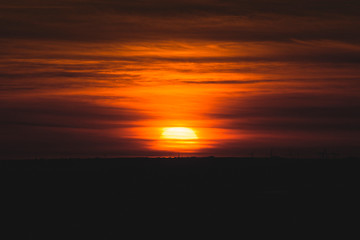 Detail of sunset in the wheat fields of Lerma with the wind power in Burgos, Spain