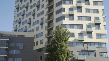 Residential building in New microdistrict. Close up Of An Apartment Blocks. The building features exterior with small balconies