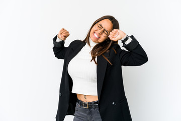 Young mixed race business woman isolated on white background stretching arms, relaxed position.
