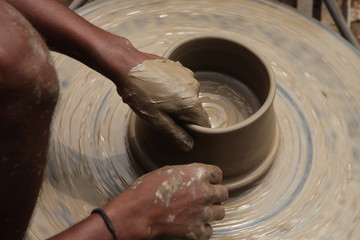 Potter man, clay molding, shaping clay molding potter, potter hand clay mold