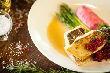 Pike-perch fillet. Asparagus, pearl couscous, white wine sauce, beet-flavored mashed potatoes....