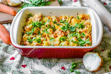 Lumaconi baked with minced meat and cheese. Stuffed pasta with cheese and herbs