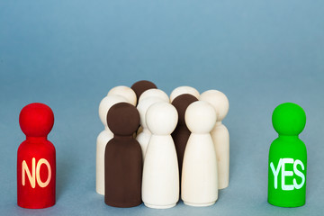 An election concept of a group of people sitting on the fence unsure about whether to vote yes or...