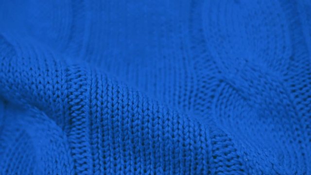 Close-up of the Blue Knitted Fabric Texture. Cozy and Soft Cotton Plaid, Textiles, Clothing. Textile Factory. Garment Industry.