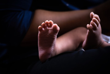 Closeup sole of newborn baby foot,blurry light around