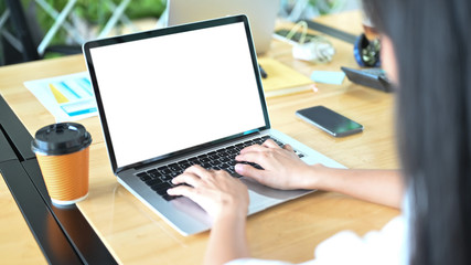 Cropped image of woman using an empty screen computer laptop.