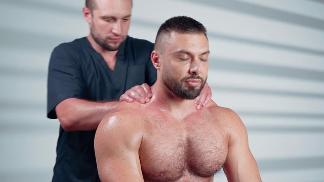 Sports massage. Man has deep tissue massage on the back