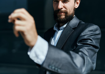 Business man in suit gestures with hand emotions outdoors lifestyle