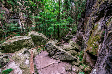 Hiking in Schwedenloecher Valley in Bastei National Park Saxon Switzerland, above the Elbe River in the Elbe Sandstone Mountains, Germany.