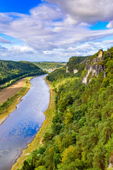 Fototapeta na wymiar View from the bastei viewpoint of the Elbe river - beautiful landscape scenery of Sandstone mountains in Saxon Switzerland National Park, Germany