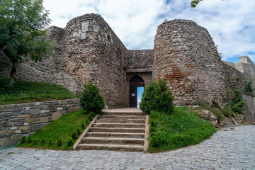 Fototapeta na wymiar Entrance into the mediaeval orthodox church Zedazeni near Mtskheta