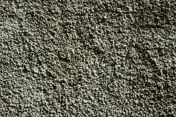 The texture of concrete with an interesting pattern in gray. Abstract architectural gray background of the wall.	