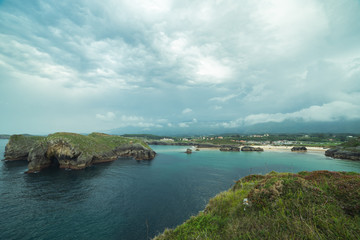 Fototapeta na wymiar Cloudy day on a beautiful beach in northern Spain