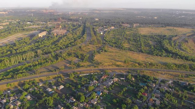Industrial suburb aerial nature and houses drone backward push out camera movement Krivoy Rog Ukraine