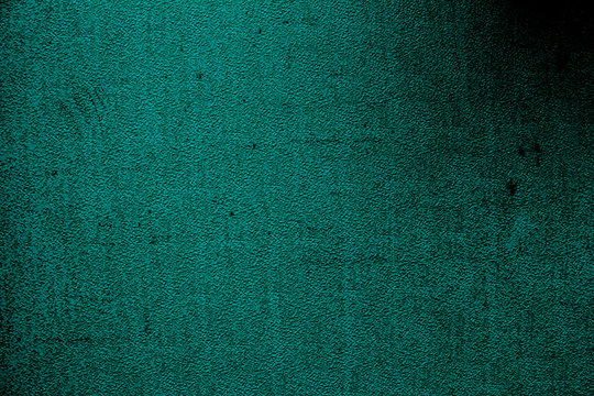 Petrol colored wall texture background with textures of different shades of petrol also called teal