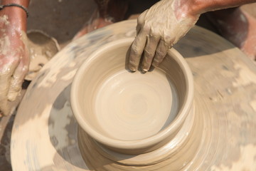 clay potter, clay molding, man plotter