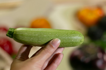 zucchini in hand close up