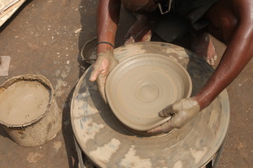 clay potter, clay molding, man plotter