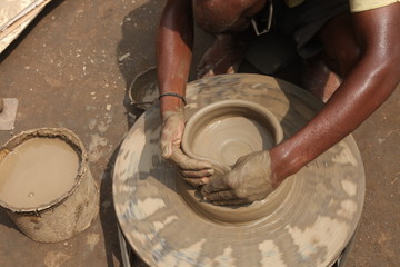 clay potter, clay molding, man plotter