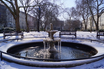 Obraz na płótnie Canvas London, UK: a frozen fountain in St George's Square Garden